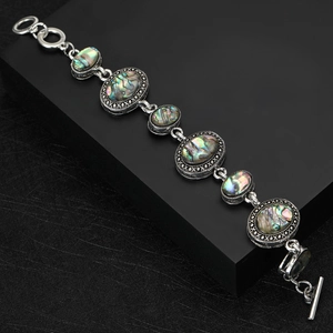 Vintage silver bracelet with natural abalone shell inlays and toggle clasp closure