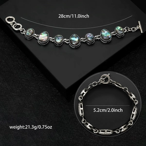 Retro silver metal bracelet with colorful abalone shells and OT clasp closure