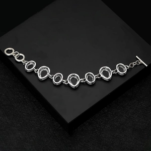 Detailed close-up of retro silver bracelet with water drop links and OT toggle clasp closure