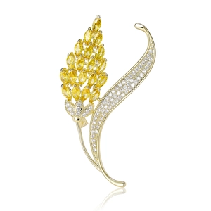 Broche d'épi de blé dorée avec pierres marquises jaunes et oxydes de zirconium blancs
