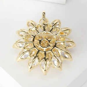 Golden lotus flower brooch with sparkling zircon inlays shown from a rear perspective