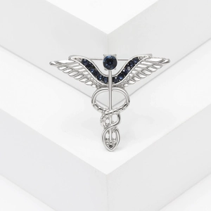 Elegant silver Caduceus brooch with blue crystal wings for women suits and cardigans