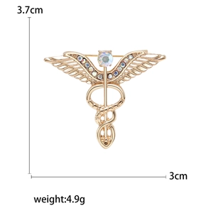Vintage gold caduceus brooch with colorful rhinestones and crystal angel wings