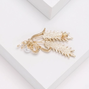 Elegant wheat stalk brooch with pearl, golden metal finish and secure pin back view
