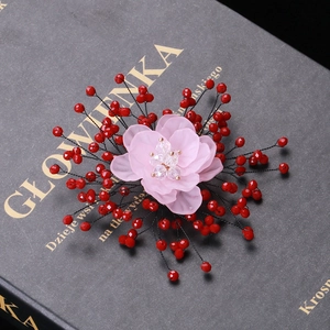 Exquisite handmade pink petal crystal flower brooch with ruby red beads on grey book