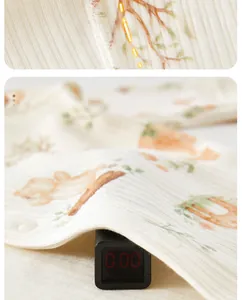 Close-up of soft ribbed baby romper fabric with elegant floral print and texture details