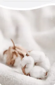 Vue macro détaillée de fibres de coton 100% naturel et d'un tissu en maille blanc
