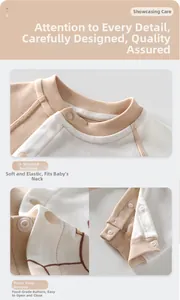 Detail of baby cotton romper showing U-shaped neckline and resin snap fasteners