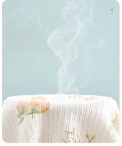 Close-up showing the high breathability of cream ribbed cotton baby underwear with mushroom print