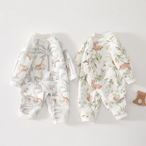 Detailed view of warm quilted newborn jumpsuits with soft earth tone animal prints