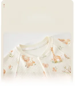 Detailed close-up of U-neck collar on soft ribbed baby jumpsuit with animal print
