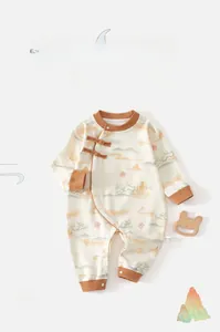 Detail of traditional Chinese baby romper with Fu character print and landscape pattern