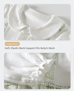 Detail of baby cotton top featuring U-shaped neckline and elastic cuffs with ruffles