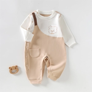 Long-sleeve cotton baby romper featuring a cute bear print and two-tone patchwork design
