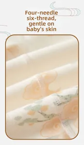 Flat seam detail on cotton baby romper showing smooth four-needle six-thread stitching