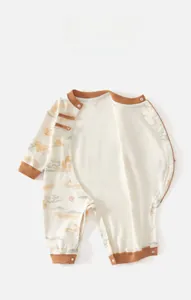 Detailed view of Chinese style baby romper featuring traditional frog buttons and cloud prints