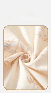 Macro shot of soft cotton fabric texture with elegant leaf prints for baby rompers