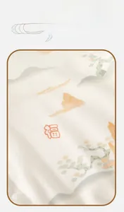 Detailed close-up of soft cotton baby romper with Fu character and auspicious clouds