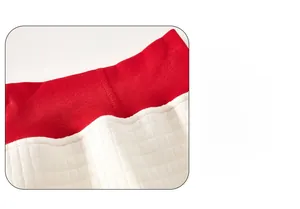 Detailed view of white quilted thermal fabric and red high-elastic high-waisted band