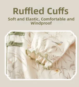 Detail of ruffled cotton sleeve with green piping and traditional Chinese frog button