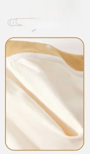 Close-up of seamless stitching and white resin snap button on cotton baby bodysuit