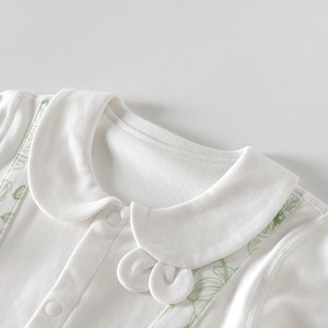 White cotton baby bodysuit with Peter Pan collar and green leaf print on shoulders