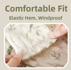 Detailed close-up of elastic cuffs on baby cotton jumpsuit with floral pattern
