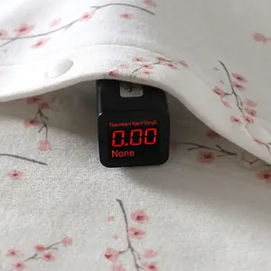 Body bébé en coton à fleurs de cerisier montrant les résultats du test de sécurité sans fluorescent