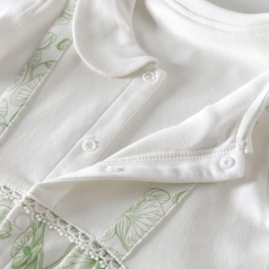 Baby cotton Peter Pan collar romper with green leaf patterns and lace trim in ivory white