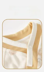 Detail of baby romper with contrast color Chinese style cross-collar and soft knit cotton