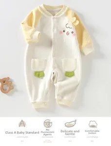 Detail of soft fleece baby romper with cute cartoon face and plaid leaf pockets