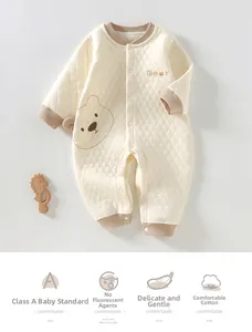 Detail of Class A infant quilted romper showing snap buttons and bear embroidery pattern