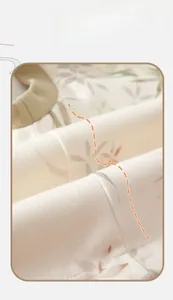 Close-up detail of thermal vest showing premium stitching and delicate floral pattern