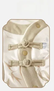 Close-up of traditional Chinese knot button on soft knitted baby warm vest fabric