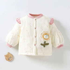 Detail of baby girl quilted autumn jacket featuring floral pattern and sunflower bear patch