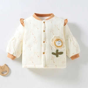 Detailed quilted texture of baby floral cardigan with cute bear sunflower patch