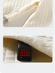 Detail of infant quilted romper showing snap buttons and zero fluorescence test result