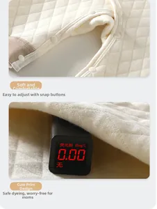 Détail de barboteuse matelassée bébé avec boutons pressions et test de fluorescence