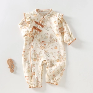 Detail of baby romper with traditional Chinese knot collar and cute rabbit pumpkin patterns