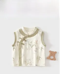 Detail of baby quilted vest with bamboo print, side opening, and traditional buttons