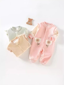 Infant waffle cotton rompers in pink, green and orange with floral embroidery detail