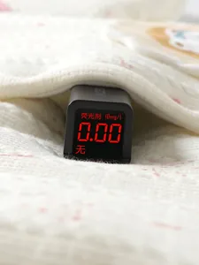 Fluorescence test showing zero content on white quilted baby fabric with pink dots