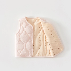 Detail of pink quilted baby winter vest showing snap buttons and feather down print lining