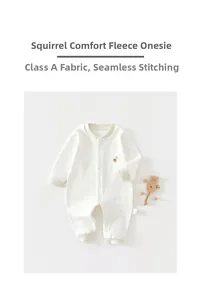 Detail of newborn cotton bodysuit featuring squirrel embroidery and soft star patterns