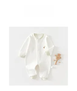 Detailed view of soft cotton baby romper with embroidery and star print on white background