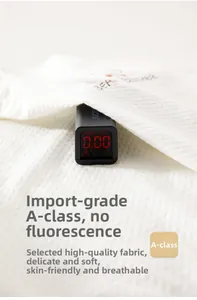 Close-up of baby garment showing 0.00 fluorescence test result on Class A cotton fabric