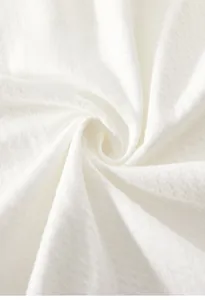 Gros plan sur le tissu en coton glacé blanc respirant pour vêtements de bébé