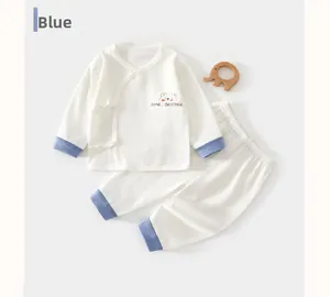 Detail of baby summer pajamas showing breathable cotton texture and bear embroidery