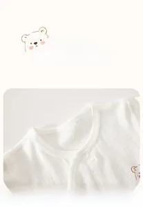 Close-up of baby pajamas with breathable honeycomb cotton fabric and soft round neckline