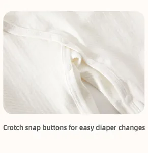 Close-up of baby romper waffle cotton fabric with white resin snaps for easy diaper changes